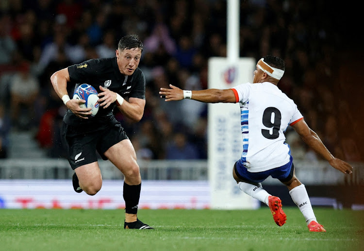 New Zealand's Cam Roigard in action with Namibia's Damian Stevens in their 2023 Rugby World Cup Pool A match at Stadium Municipal de Toulouse in France on September 15 2023.