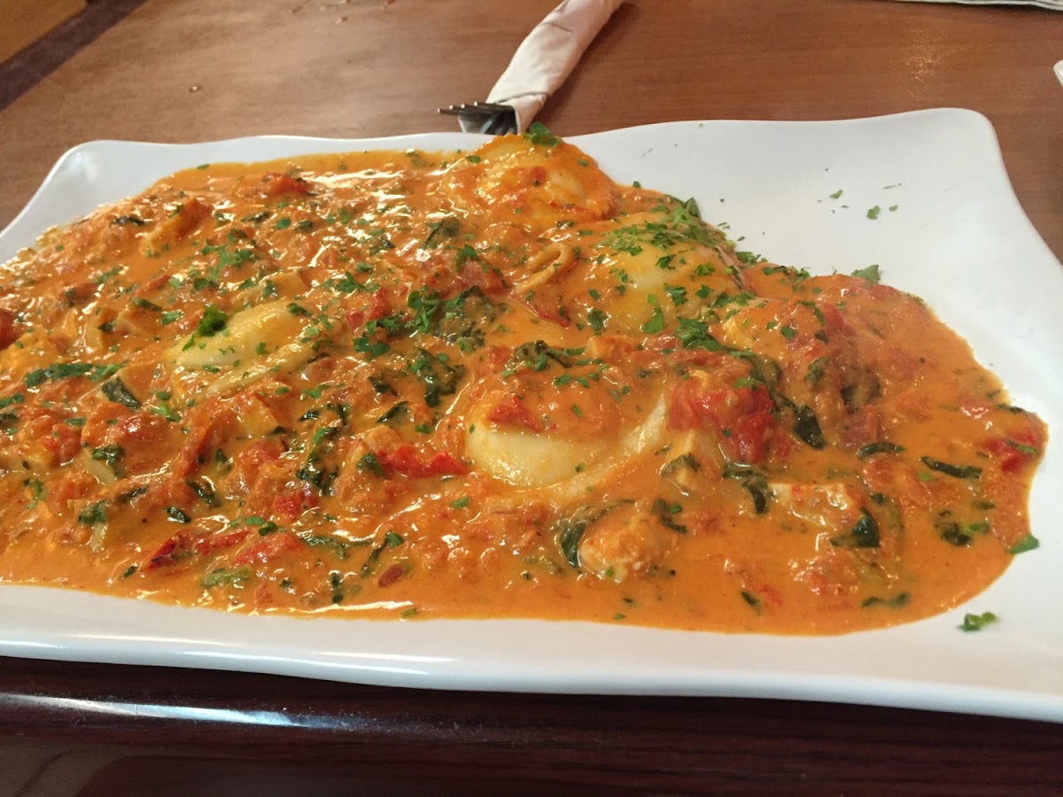 Francesca Chicken--diced, grilled chicken in a rosy cream sauce over cheese ravioli. Yum!