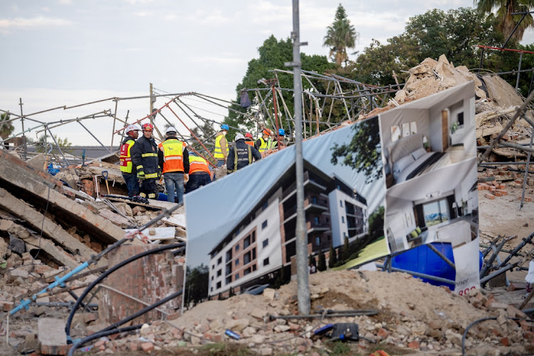 A billboard during search and rescue efforts at the Neo Victoria apartment building in Victoria Street on May 07, 2024 in George, South Africa. It is reported that 6 people have died since the building collapsed.