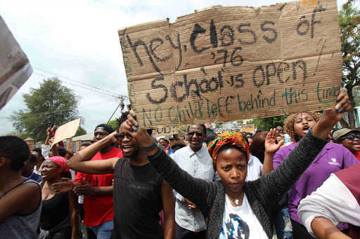 United we stand: Rhodes University vice chancellor Dr Sizwe Mabizela leads student protests over high fees Picture: David Macgregor