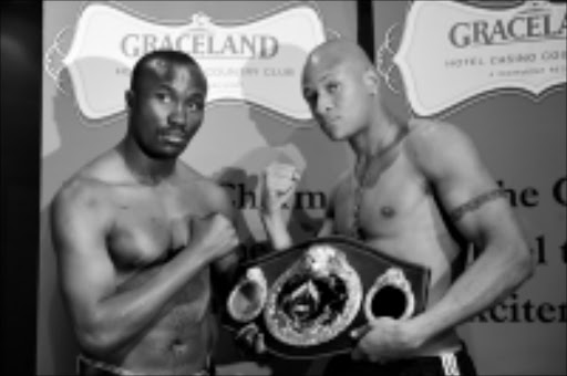 STRAIGHT FACES: Warriors David Kitooke, left and Isaac Chilembe will fight for the vacant WBO African light heavyweight title at Graceland Casino on Saturday. Pic. Tsheko Kabasia. 06/06/2009. © Sunday World.