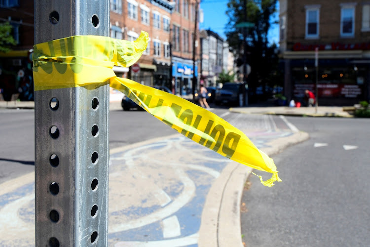 Police tape is pictured at a crime scene after a deadly mass shooting on South Street in Philadelphia, Pennsylvania, US on June 5, 2022.