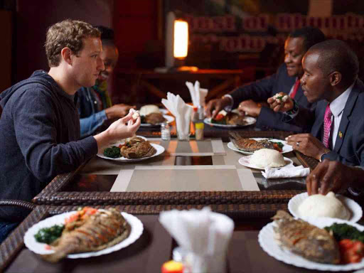 Facebook founder Mark Zuckerberg eat lunch with Kenya CS Joe Mucheru at Mama Oliech's in Yaya, Nairobi Photo/Zuckerberg Facebook