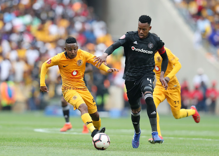 Kaizer Chiefs midfielder Pule Ekstein (L) challenges Orlando Pirates defender and captain Happy Jele (R) during the 1-1 Absa Premiership Soweto derby draw at FNB Stadium on February 9 2019.