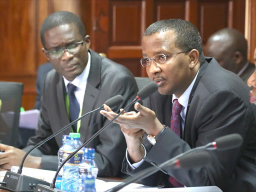 Former IEBC chair Issack Hassan with CEO Ezra Chiloba during a past appearance before Parliament Committee on Justice and Legal Affairs. /FILE