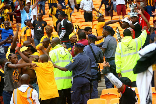 Chiefs and Pirates supporters fighting during the Telkom Knockout Semi Final match between Kaizer Chiefs and Orlando Pirates at FNB Stadium. Photo. Veli Nhlapo.@ Sowetan
