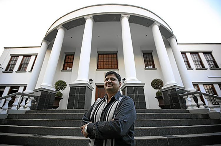 Atul Gupta, at the bottom of the steps to his Saxonwold, Johannesburg home. File photo.
