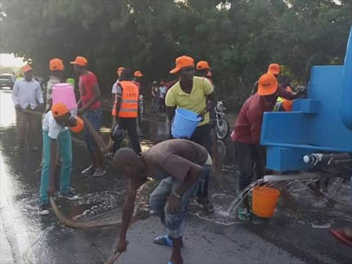 Youths wash roads ahead of Cord leader Raila Odinga arrival in Turkana. /COURTESY