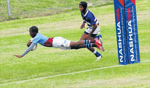 FIVE-POINTER: Port Rex flyhalf Anathi Diko dives over for a try early on the match against Adelaide Gymnasium. The Adelaide player too late to stop him is Luigi Johannes Picture: MICHAEL PINYANA