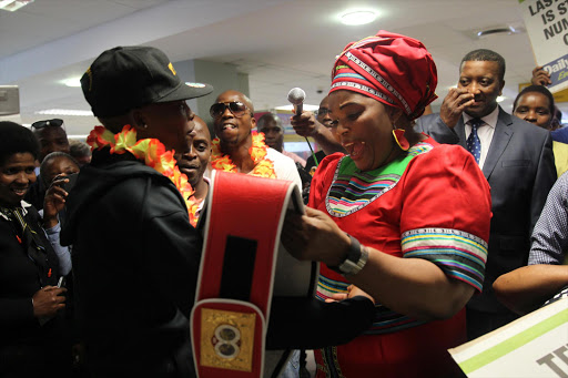 HITTING SNAG: IBF champion Zolani Tete with sport, arts and culture MEC Pemmy Majodina at the East London Airport after beating Paul Buttler in his own backyard in the United Kingdom. Majodina now appears to be failing to keep her promise of helping Tete to fight at home in his next title defence Picture: MICHAEL PINYANA