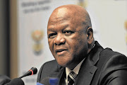 Justice and Constitutional Development Minister Jeff Radebe fields questions at a press conference in Cape Town yesterday following the release of his department's discussion document on the judiciary Picture: TREVOR SAMSON/BUSINESS DAY