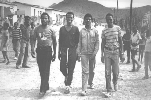 Fort Calata, second from right, and Matthew Goniwe, far right, two of the Cradock Four who were murdered by security police in 1985, are accompanied home by two activists after being released from detention in 1984. Archive image: ARENA HOLDINGS