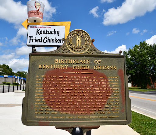 BIRTH OF A LEGEND KENTUCKY'S MOST FAMOUS CITIZEN Colonel Harland Sanders began the part of this life that brought him fame in a small gasoline service station on the opposite side of this highway....