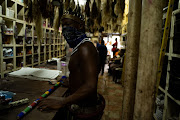 Thando Mahlangu visits a traditional African shop on Bloed Street in Pretoria to do his monthly shopping. 