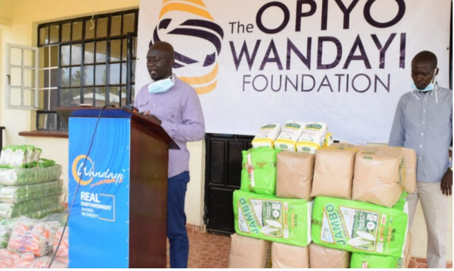 Opiyo Wandayi Foundation officials distribute food and household supplies to Ugunja constituency residents on April 7.