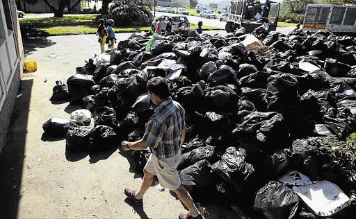 MUNICIPAL DUMPSITE: Fed-up Gonubie residents dumped thousands of garbage bags outside the municipal offices in Main Road at the weekendPicture: MARK ANDREWS