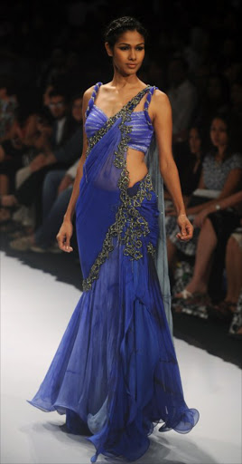 A model showcases a creation by designer Archana Kochhar on the final day of Lakme Fashion Week (LFW) winter/festive 2012 in Mumbai on August 7, 2012. The LFW, held bi-annually, features creations by over 85 designers and will culminate with a grand finale on August 7.