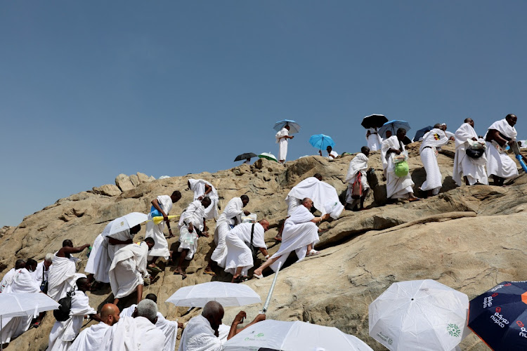 Muslim pilgrims climb Jabal al-Rahmah, also known as Mount Arafat, during the annual hajj pilgrimage, outside the holy city of Mecca, Saudi Arabia, on June 5 2025.