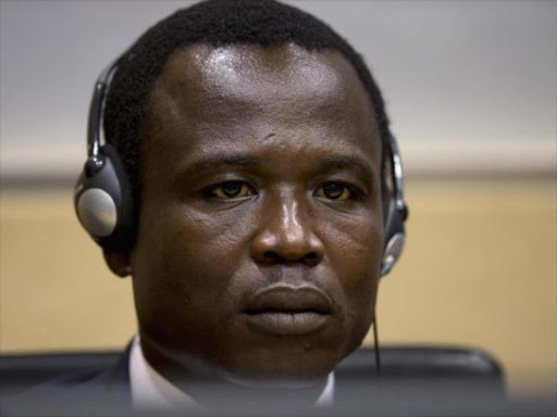 Dominic Ongwen, a commander of the Ugandan Lord's Resistance Army (LRA), waits for the judge to arrive, during his first appearance at the International Criminal Court in The Hague, Netherlands, January 26, 2015. Photo/REUTERS