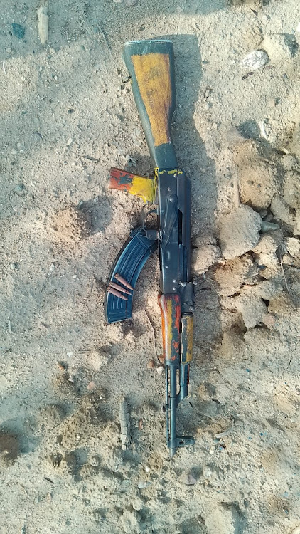 A weapon recovered from slain men on March 30