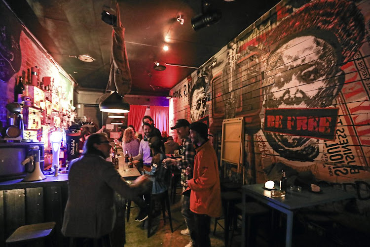 Patrons enjoy a drink in a pub in Melville, Johannesburg. File photo.