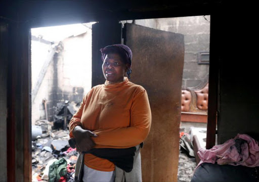 Nomonde Moyikwa of Reeston saw parts of her rdp house burn down on sunday evening.picture:SIBONGILE NGALWA