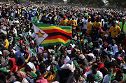 Supporters of President Emmerson Mnangagwa gather at an election rally in Marondera, Zimbabwe, July 21, 2018. 