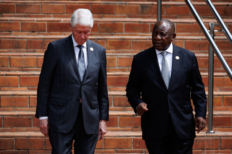 Former US president Bill Clinton, left, and President Cyril Ramaphosa talk ahead of an event to commemorates the 30th anniversary of the Tutsi genocide, in Kigali, Rwanda, April 7 2024. Picture: Luke Dray/Getty Images)