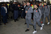 FC Barcelona superstars are ushered out of OR Tambo International Airport amid heavy police presence. The Spanish giants landed on Wednesday May 16 2018 and headed for their hotel in Sandton. 