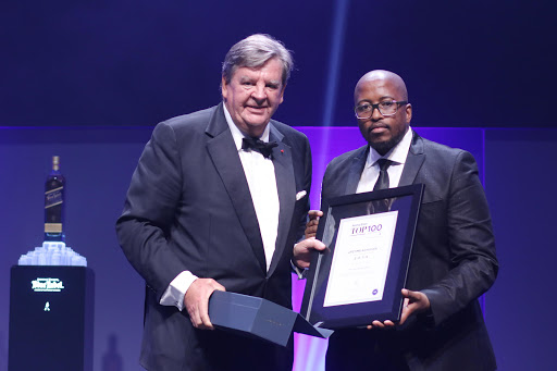 Dr Johann Rupert with Sunday Times editor Bongani Siqoko at the Sunday Times Top 100 Companies Awards at the Sandton Convention Centre, Johannesburg, on November 8, 2016.