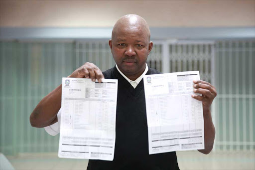 NOT ADDING UP: Xolani Dezide shows his September and October municipal bills for which he owed R2.1-million Picture: MARK ANDREWS
