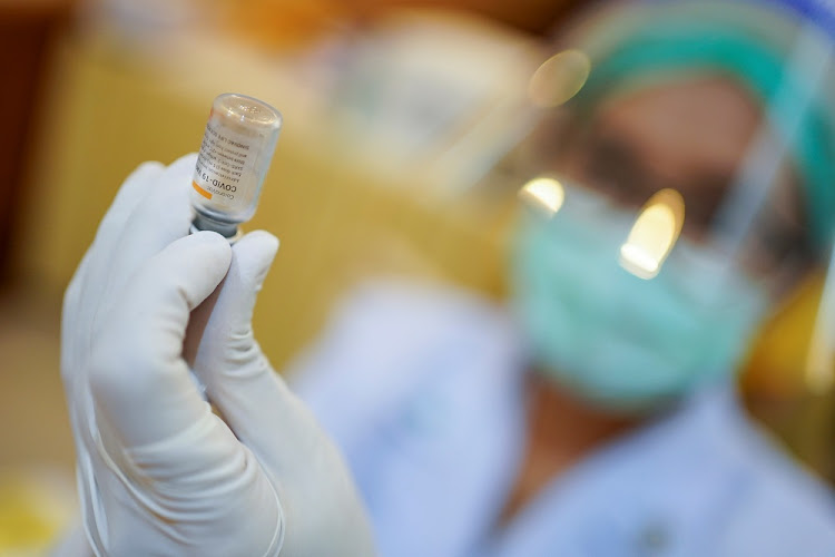 A health worker holds up a vial of Sinovac's CoronaVac coronavirus disease (COVID-19) vaccine at the Samut Sakhon hospital in Samut Sakhon province, Thailand, February 28 2021.