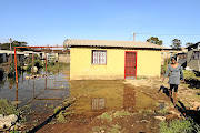 Mapule Mabesele  shows her flooded home at France section of  Boipatong in  Vanderbijlpark. She has since abandoned her home.  / Thulani Mbele