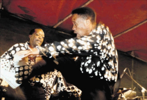 SHOWMEN: Two members of the Soul Brothers performing at a festival on the East Rand. Pic. Sefako Mabuya. 25/07/2000. © Sowetan.