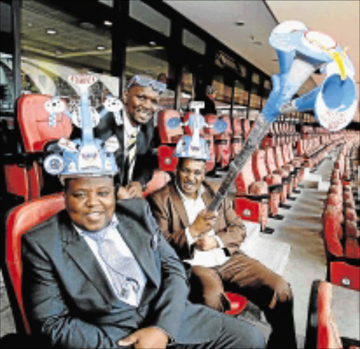 July 15, 2014. POUND SEATS: Getting ready for the new season at the Nelson Mandela Bay Stadium are, from left, Chippa United boss Siviwe Chippa Mpengesi, Safa NMB regional president Monde Mhletywa and deputy mayor Chippa Ngcolomba. Pic: Judy de Vega. © The Herald.