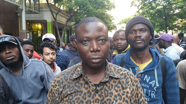 Community leader Jean Pierre Balous says the foreigners will continue to occupy Waldorf Arcade until hundreds of refugees are given safe passage out of the country.
