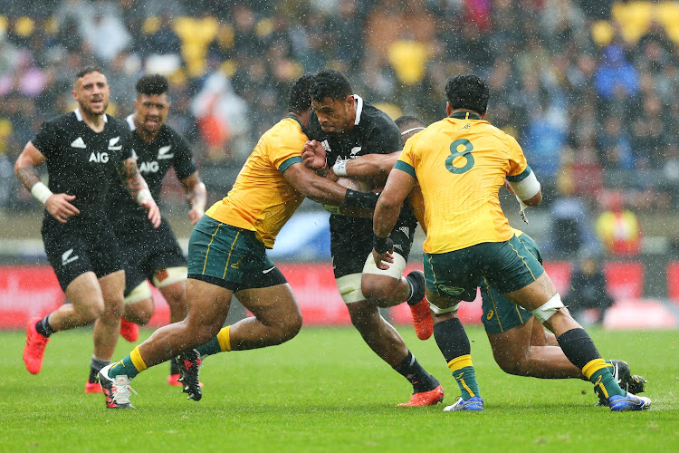 Tupou Vaa'i attempts to power his way through a tackle.