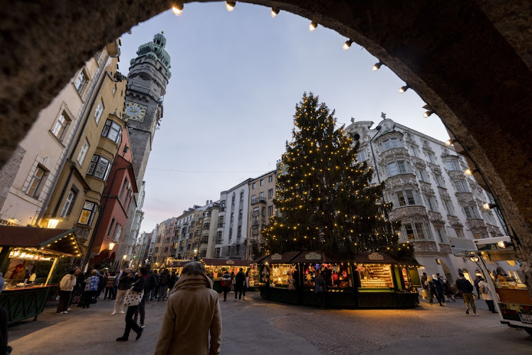 People gather at the annual Christmas market during the first day of a nationwide lockdown for people not yet vaccinated against the novel coronavirus on November 15, 2021 in Innsbruck, Austria.