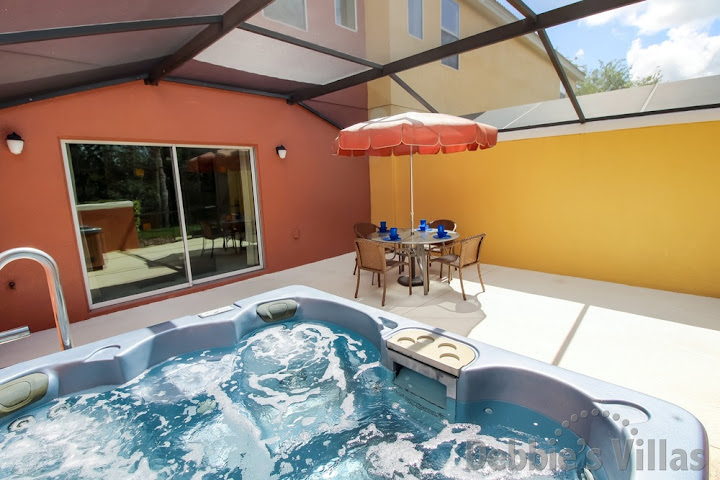 Freestanding hot tub on the west-facing patio area of this Kissimmee holiday home