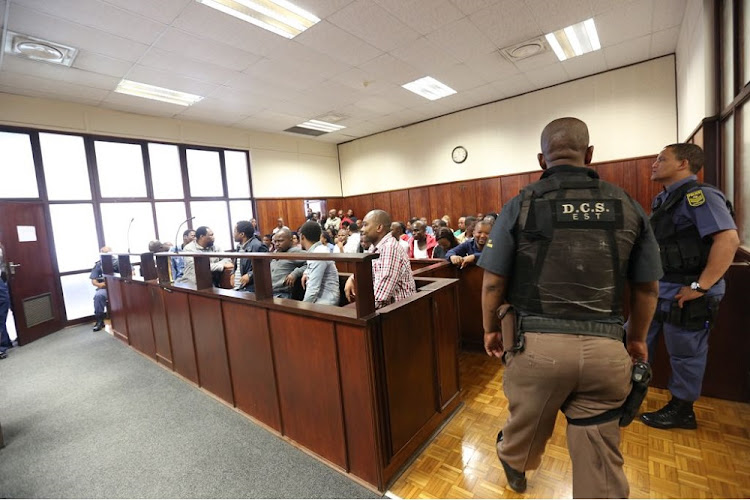 There was a strong police presence when the Glebelands seven‚ an alleged hit squad‚ appeared in the Durban Magistrate's court on Thursday for a bail application. Detective sergeant Bhekukwazi Louis Mdweshu‚ 27‚ Ncomecile Matlala Ntshangase‚ 34‚ Khayelihle Mbuthuma‚ 32‚ Eugene Wonderboy Hlope‚ 45‚ Mbuyiselwa Mahliphiza Mkhize‚ 28‚ Vukani Mcobothi‚ 25‚ and Mondli Talente Mthethwa‚ 28‚ appeared in the Durban Regional Court.