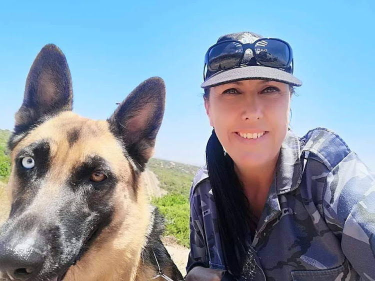Nicci Swartz and her partner in crime-fighting, Blu. Swartz started out helping out with anti-poaching intelligence-gathering by taking photographs but before long was managing the anti-poaching unit.