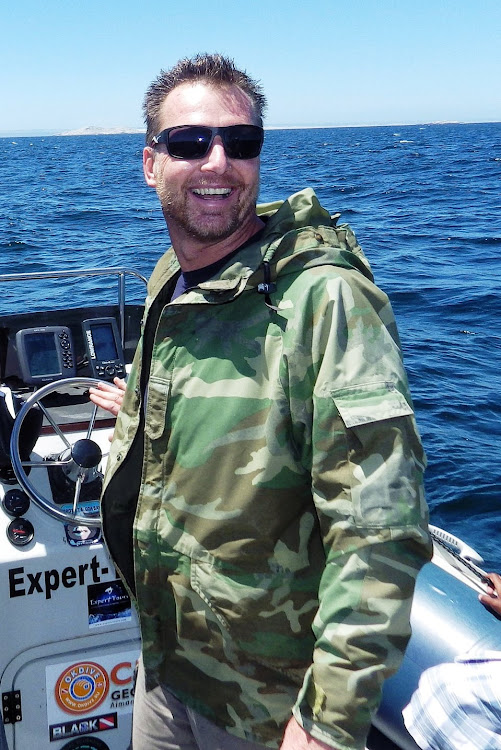 Rainer Schimpf at the wheel of his boat in Algoa Bay.
