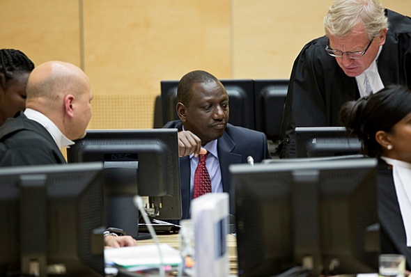Deputy President William Ruto consults with his lawyers during the ICC hearings.