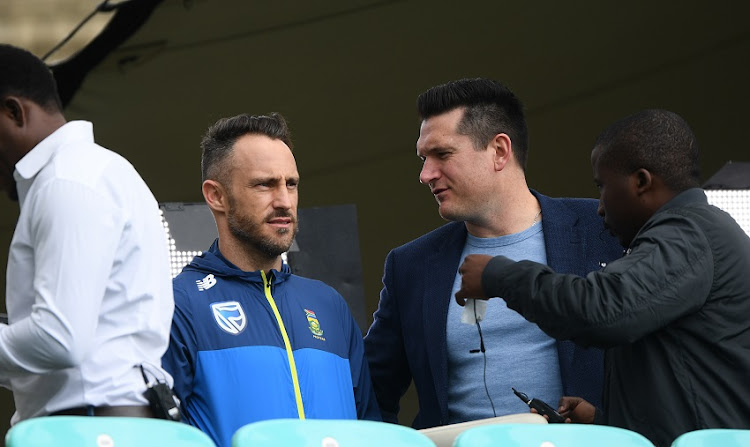 South Africa captain Faf du Plessis talks with ex captain Graeme Smith ahead of their opening ICC CRricket World Cup match against England at The Oval on May 29, 2019 in London, England.
