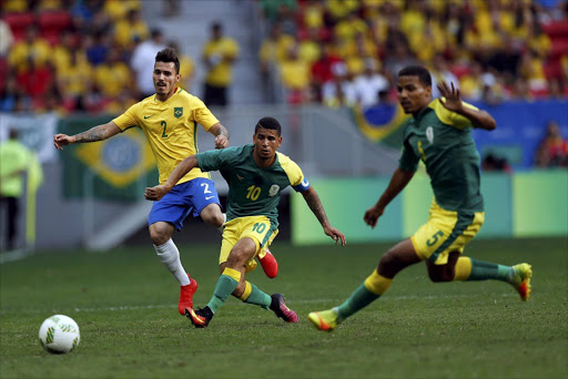 Zeca of Brazil, Keagan Dolly of South Africa and Rivaldo Coetzee of South Africa during the match. Picture credits: Reuters