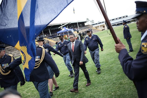Police Minister Fikile Mbalula inspects a police guard during the launch of the newly trained Tactical Response Team at the police training ground in Pretoria. The TRT team underwent a new rigorous training programme aimed at improving reaction time and apprehension of perpetrators in medium to high risk incidents of crime. / Alaister Russell
