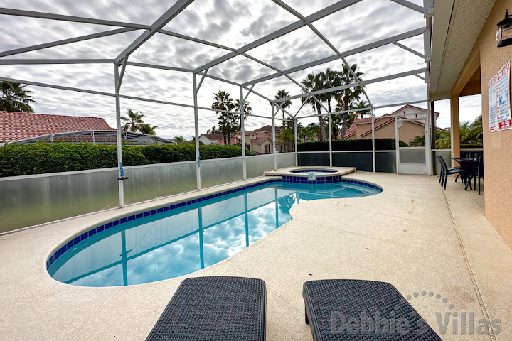 Enjoy a peaceful morning coffee on the secluded pool deck at this Davenport vacation villa