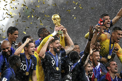 France captain Hugo Lloris lifts the World Cup trophy to celebrate with his teammates following their win over Croatia in yesterday's final at Luzhniki Stadium in Moscow.