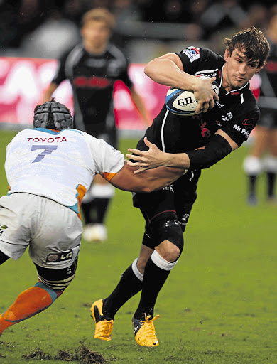 Lappies Labuschagne tackles Keegan Daniel during the Super rugby match between the Sharks and the Cheetahs in Durban on Saturday