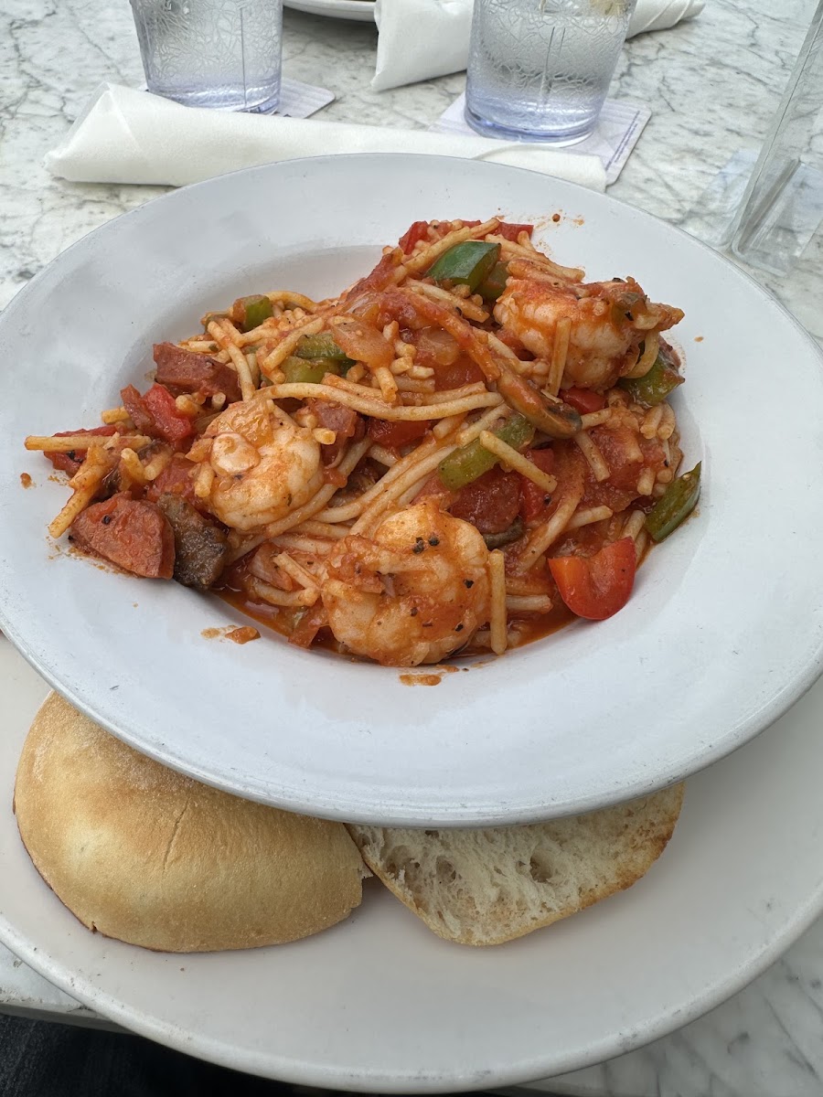 GF pasta with shrimp and sausage in a spicy red sauce